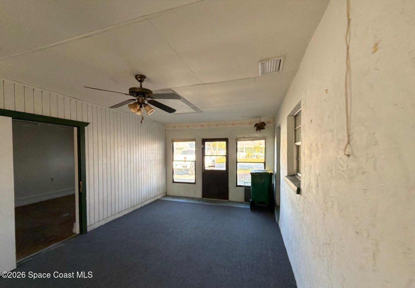 2972 Matthew Drive Rockledge, FL 32955 - Photo 7 of 24 a view of a hallway with a chandelier