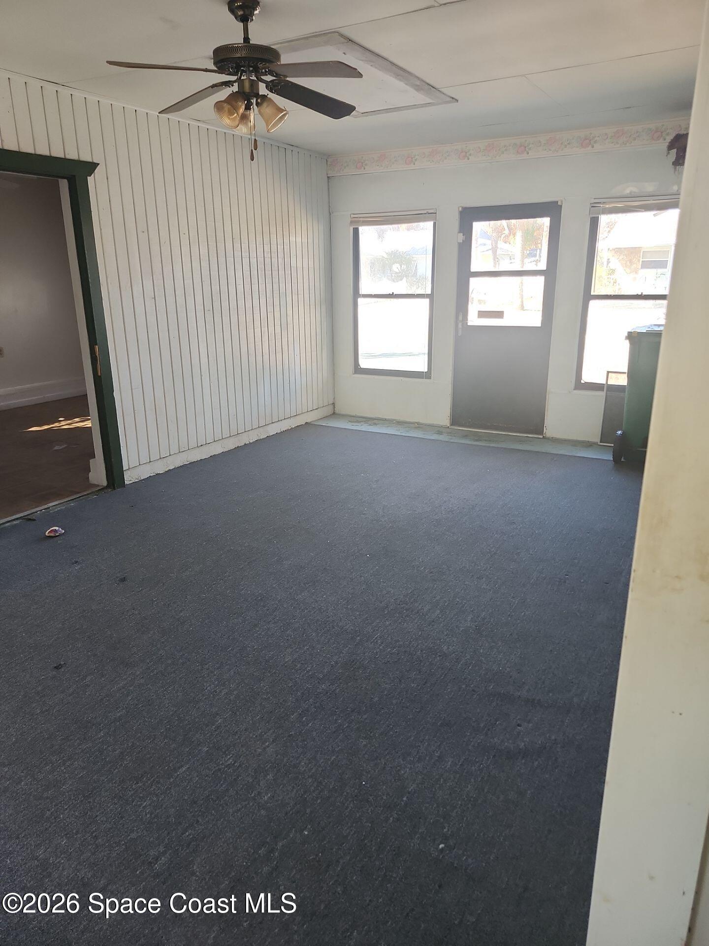 2972 Matthew Drive Rockledge, FL 32955 - Photo 8 of 24 a view of a livingroom with a ceiling fan and window