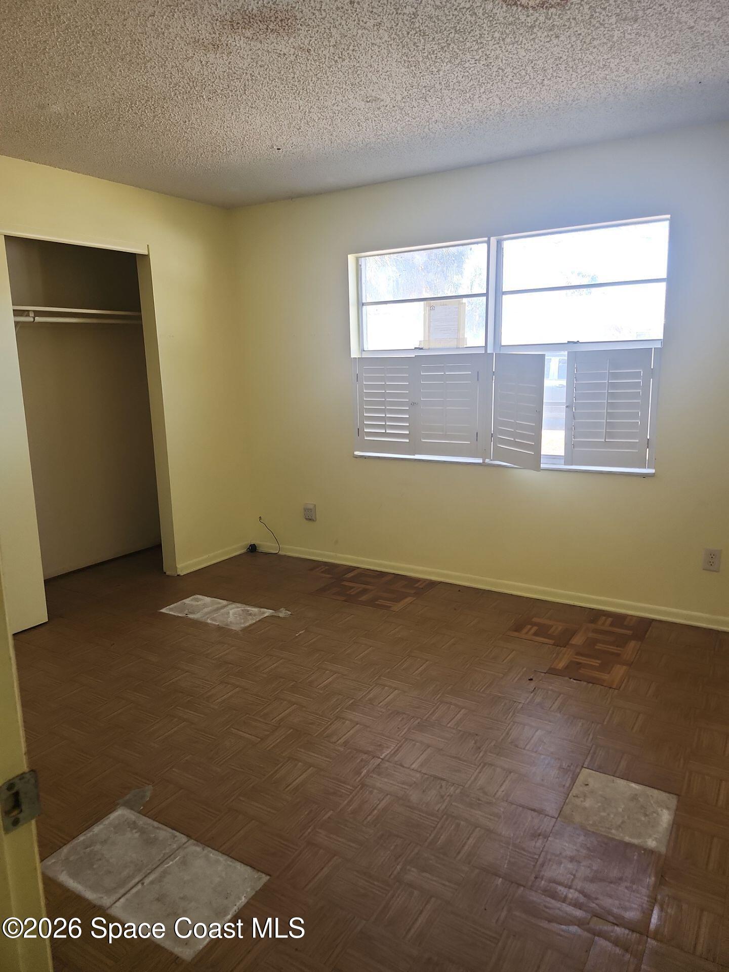 2972 Matthew Drive Rockledge, FL 32955 - Photo 9 of 24 an empty room with a empty space and windows