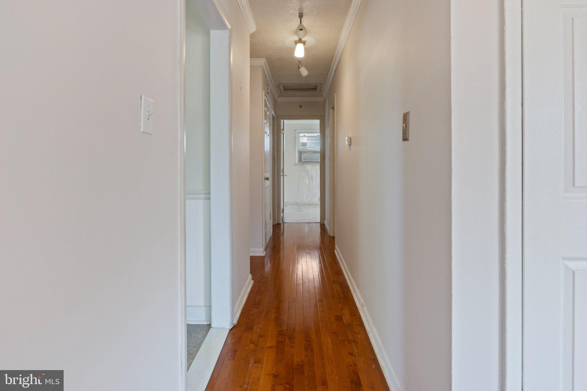2514 Ritchie Road District Heights, MD 20747 - Photo 8 of 24 Inviting hallway with warm wood floors.