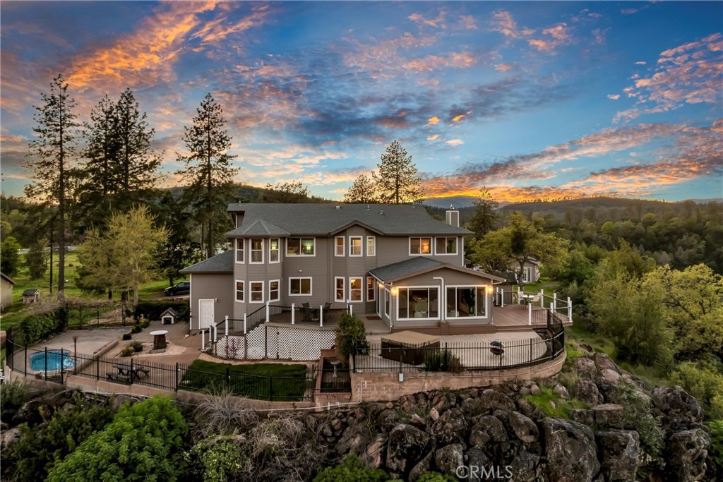 20250 Black Bass Pass Road Lower Lake, CA 95457 - Photo 1 of 66 a front view of a house with a garden