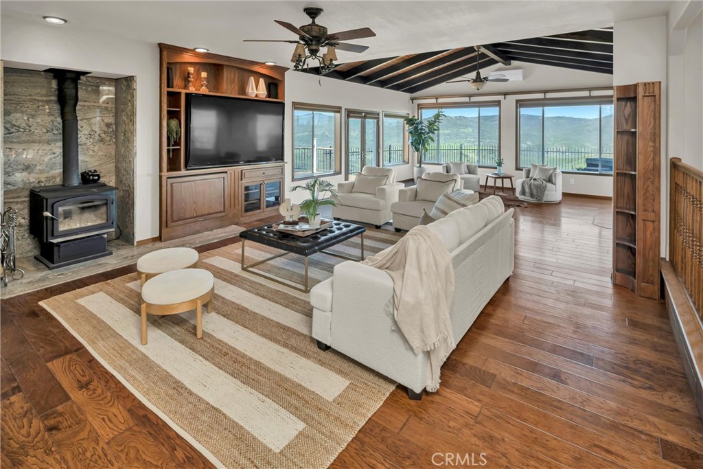 20250 Black Bass Pass Road Lower Lake, CA 95457 - Photo 11 of 66 a living room with furniture and a flat screen tv