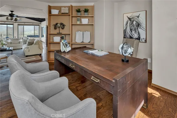 a kitchen with stainless steel appliances granite countertop a sink a stove and a wooden cabinets