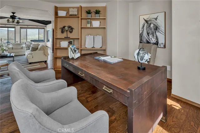 a kitchen with stainless steel appliances granite countertop a sink a stove and a wooden cabinets