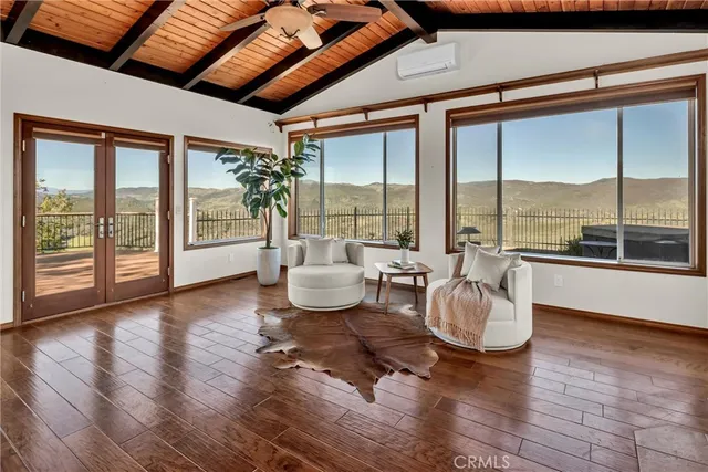 a bathroom with a granite countertop toilet sink and mirror