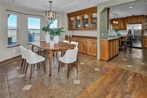 a bedroom with a bed and painting on the wall