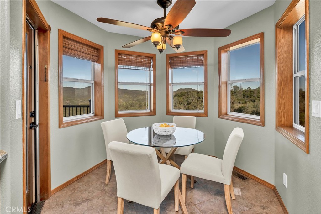 20250 Black Bass Pass Road Lower Lake, CA 95457 - Photo 24 of 66 a dining room with furniture and window