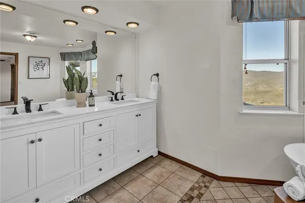 a view of a terrace with lawn chairs