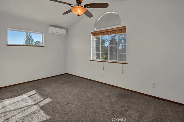 a aerial view of a house with a yard basket ball court and outdoor seating