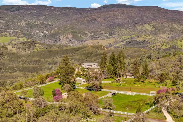 an aerial view of residential building with outdoor space and lake view