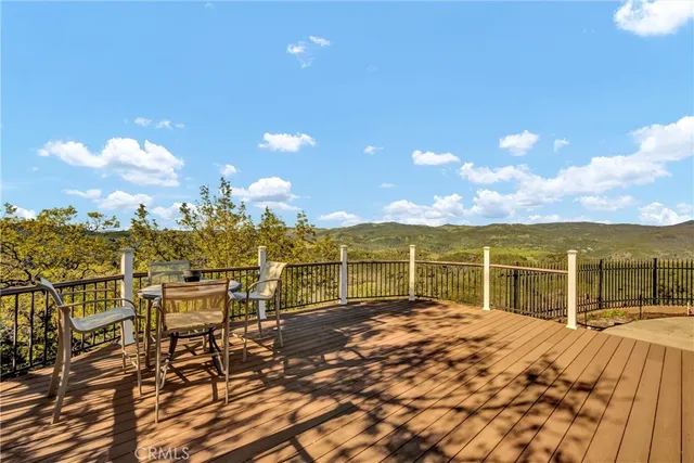 a view of a terrace with furniture and wooden floor