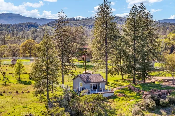 a view of a town with trees in the background