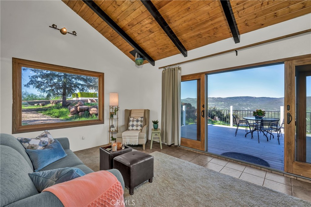 20250 Black Bass Pass Road Lower Lake, CA 95457 - Photo 50 of 66 a living room with furniture a rug and a large window