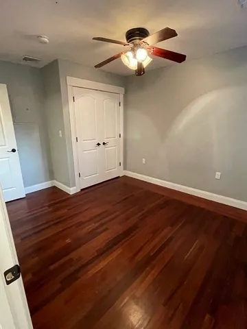 a view of room with wooden floor