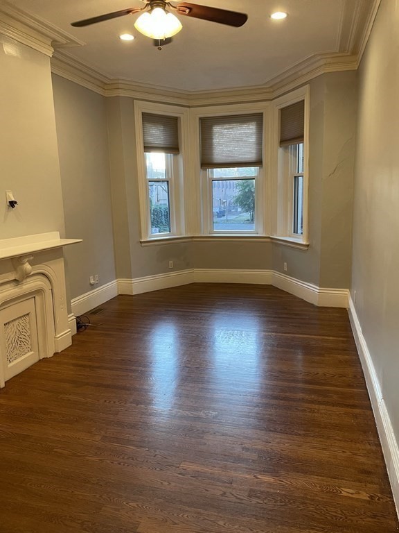 1 Wigglesworth Street, Unit 1 Boston, MA 02120 - Photo 2 of 39 an empty room with wooden floor and windows