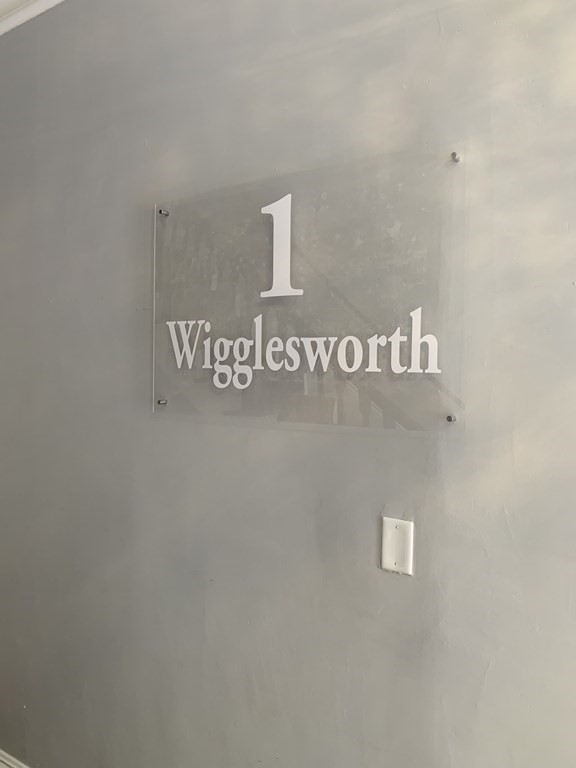 1 Wigglesworth Street, Unit 1 Boston, MA 02120 - Photo 23 of 39 a close up of a street sign