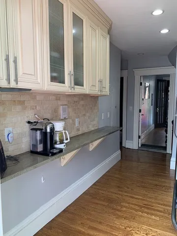 a kitchen with sink and cabinets