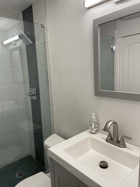 1 Wigglesworth Street, Unit 1 Boston, MA 02120 - Photo 10 of 39 a bathroom with a sink toilet and shower