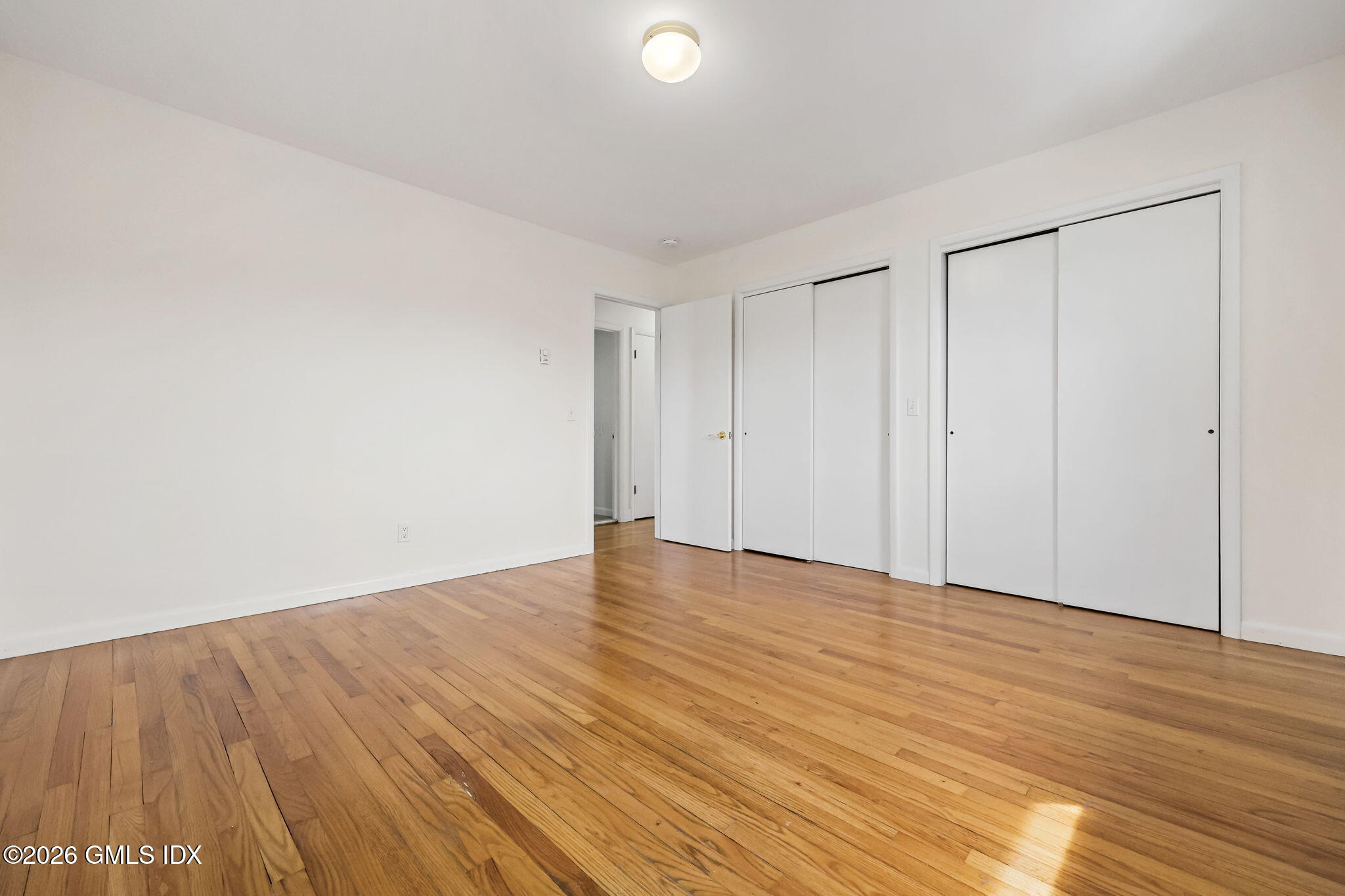 2 Grange Street Greenwich, CT 06830 - Photo 24 of 31 a view of an empty room with wooden floor