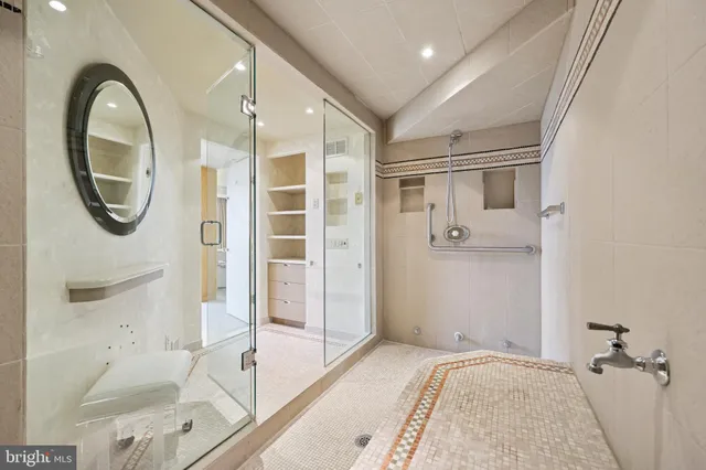 a view of entryway with a rug and a mirror