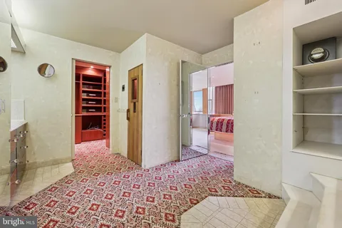 a bathroom with a tub and shower