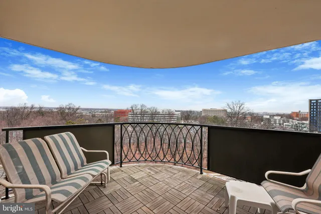 a living room with furniture cabinets and a window