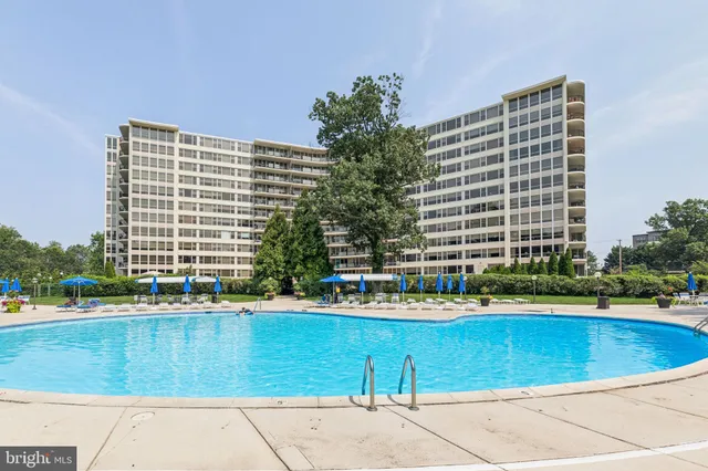 a living room with furniture a book shelf and a book shelf