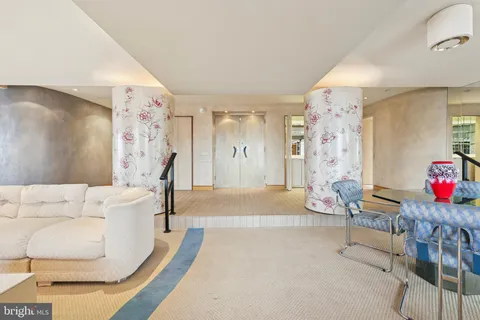 a living room with furniture and a table