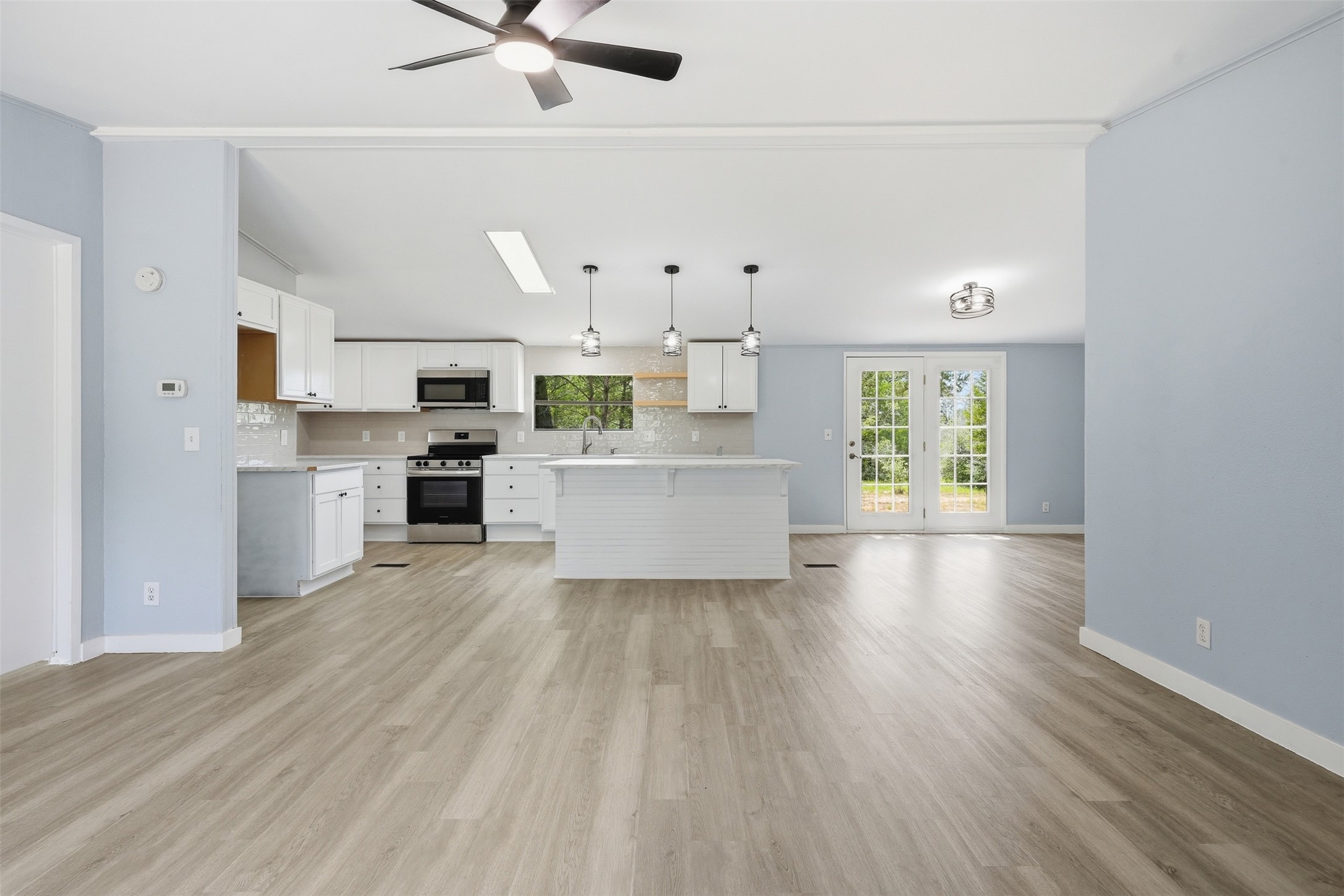 154 Antioch Road Smithville, TX 78957 - Photo 5 of 32 An open-concept layout unites the kitchen and living areas, offering effortless entertaining and everyday comfort.