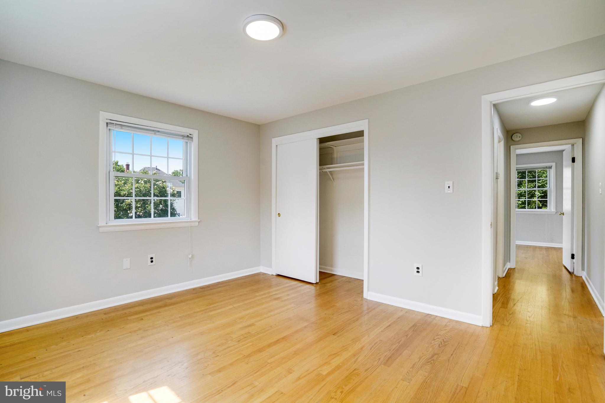 706 North Cleveland Street Arlington, VA 22201 - Photo 16 of 59 a view of a room with wooden floor and window