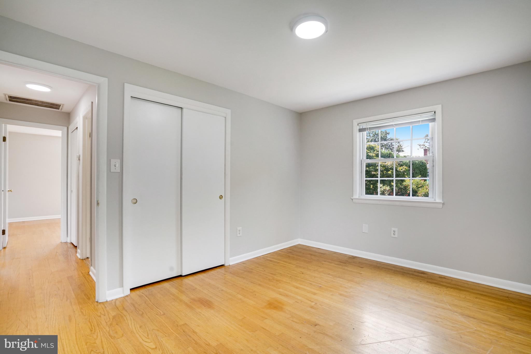 706 North Cleveland Street Arlington, VA 22201 - Photo 23 of 59 a view of empty room with window and wooden floor
