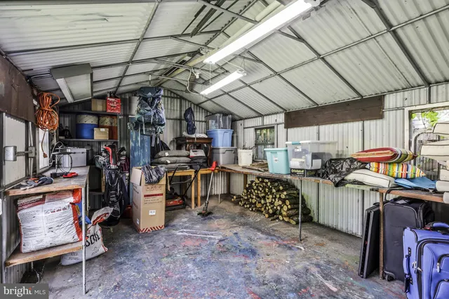 a view of a house with backyard and a tree