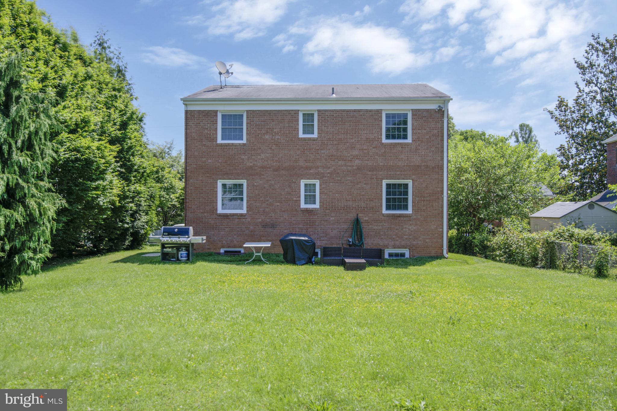 706 North Cleveland Street Arlington, VA 22201 - Photo 50 of 59 a view of a house with a yard