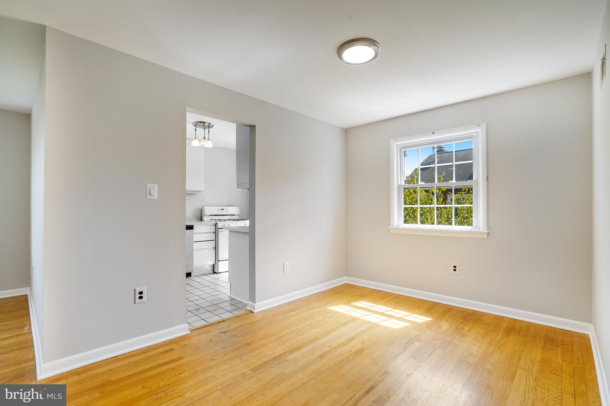 706 North Cleveland Street Arlington, VA 22201 - Photo 8 of 59 a view of empty room with wooden floor