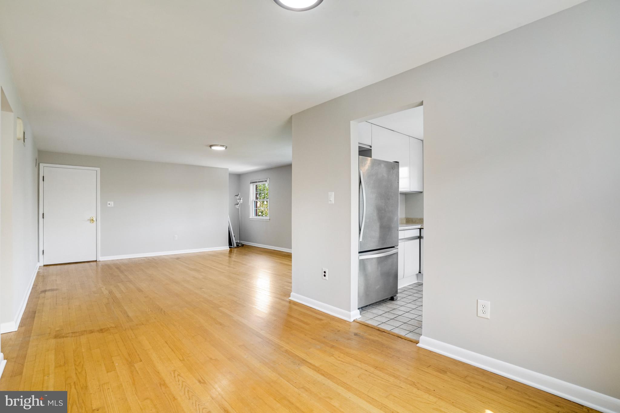 706 North Cleveland Street Arlington, VA 22201 - Photo 10 of 59 a view of a kitchen with a sink and a refrigerator