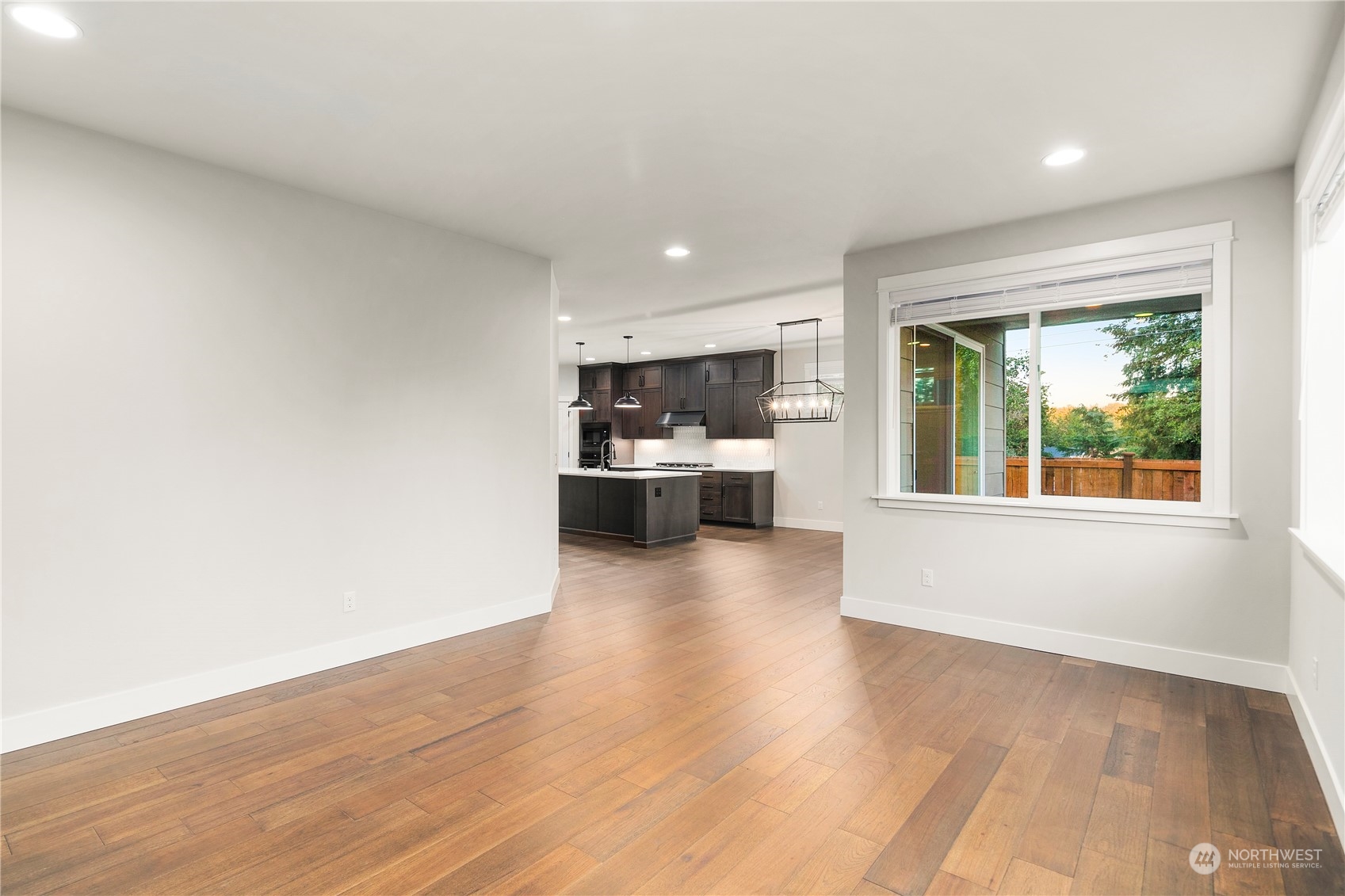 1302 197th Place Southeast Bothell, WA 98012 - Photo 13 of 35 a view of a kitchen with wooden floor and a window