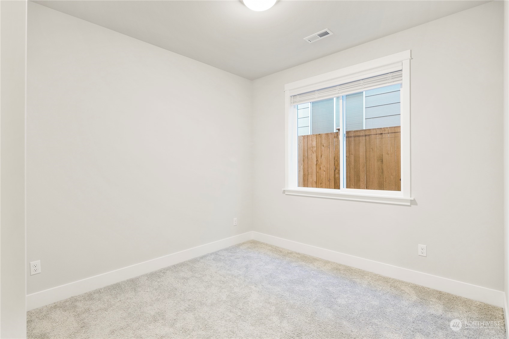 1302 197th Place Southeast Bothell, WA 98012 - Photo 17 of 35 an empty room with a window