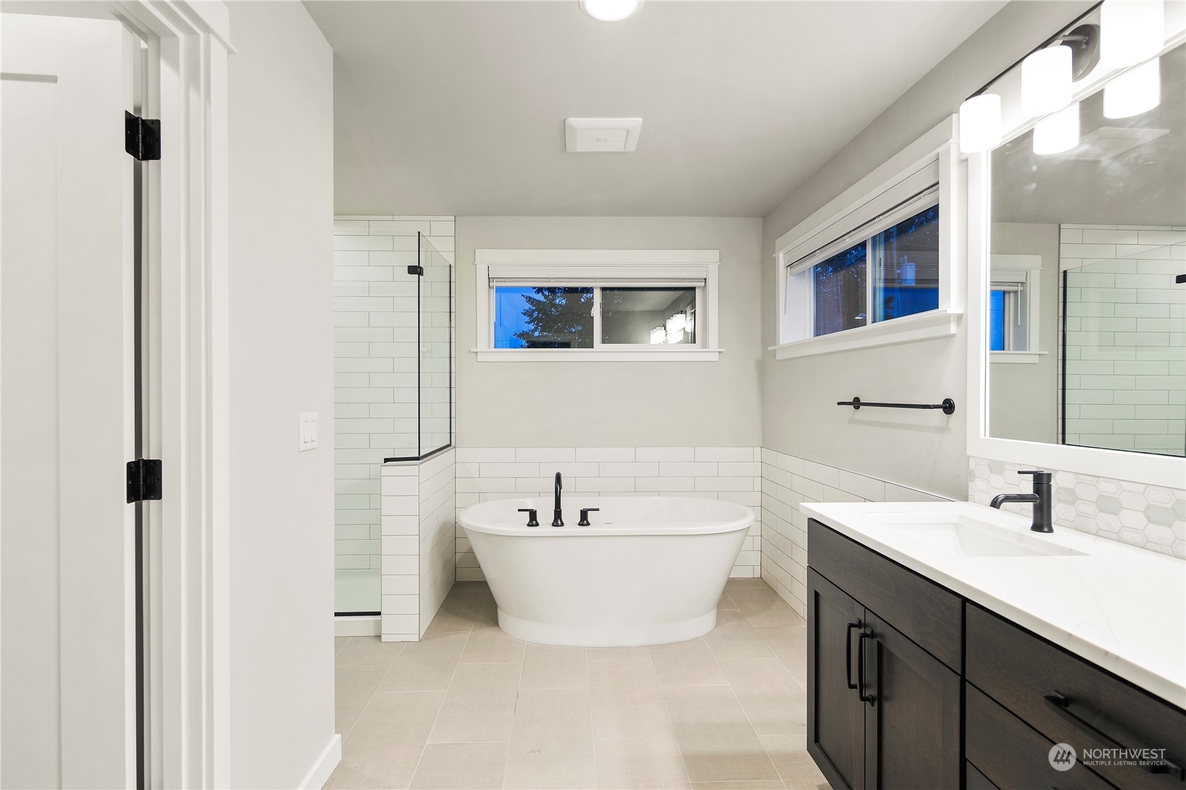 1302 197th Place Southeast Bothell, WA 98012 - Photo 25 of 35 a bathroom with a double vanity sink mirror and bathtub