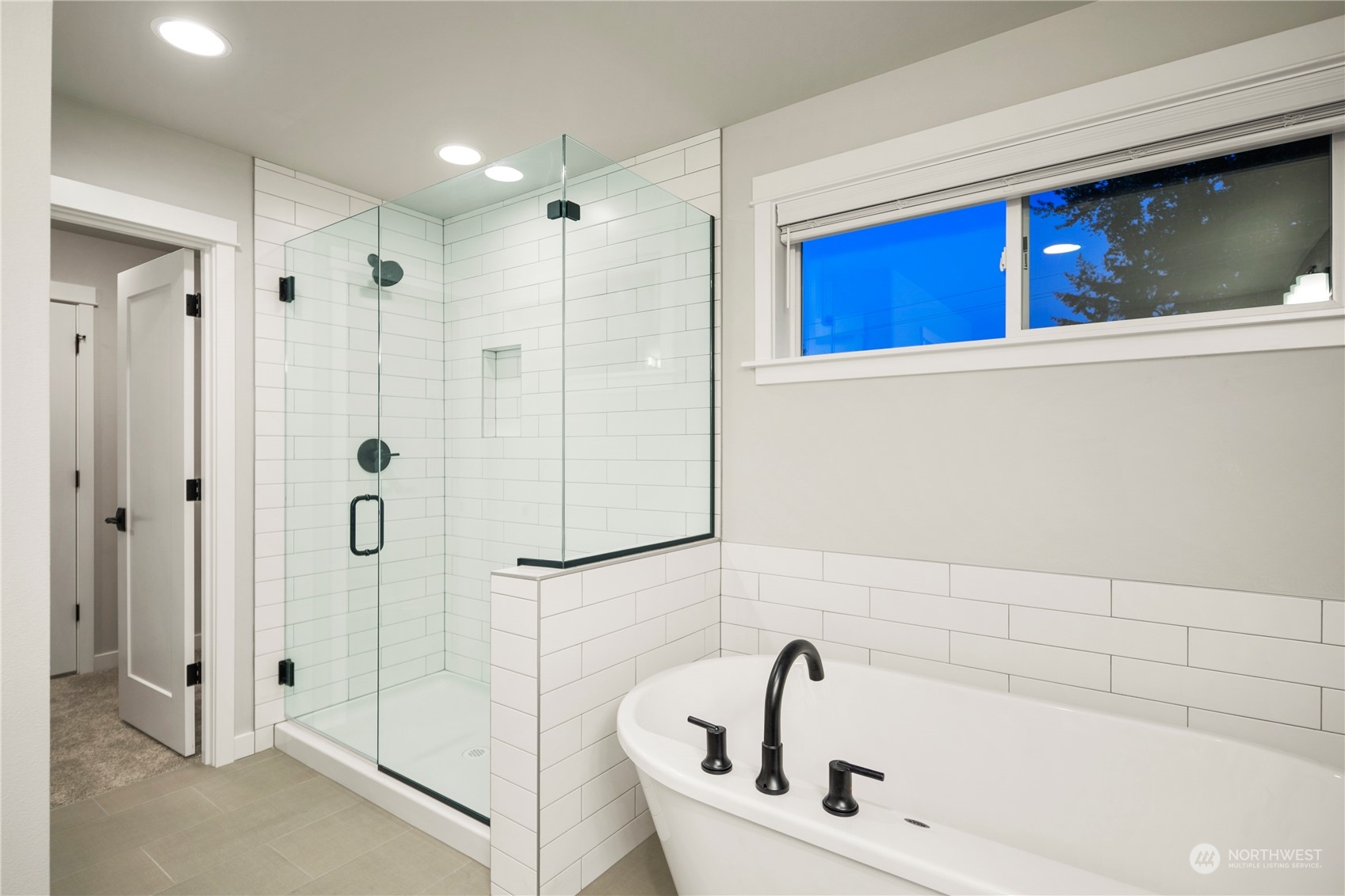 1302 197th Place Southeast Bothell, WA 98012 - Photo 26 of 35 a bathroom with a bathtub and a shower