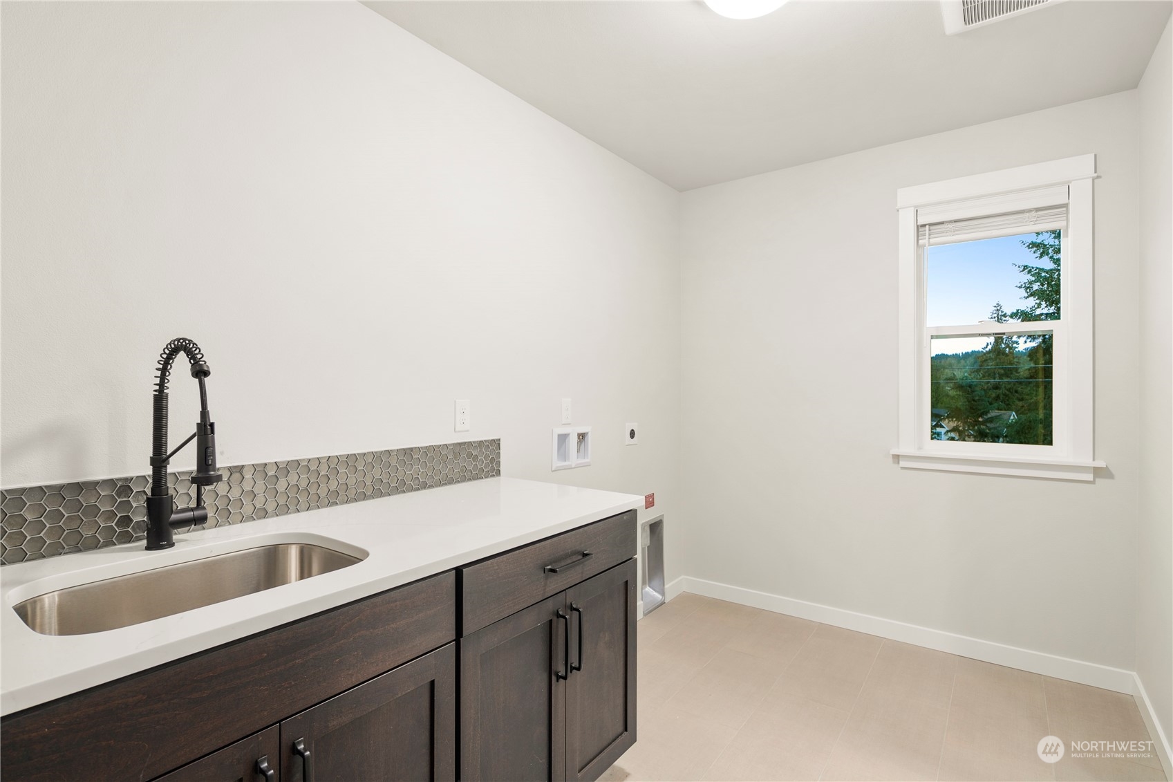 1302 197th Place Southeast Bothell, WA 98012 - Photo 28 of 35 a bathroom with a sink and a window