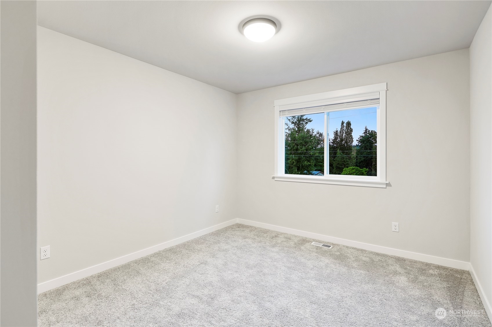 1302 197th Place Southeast Bothell, WA 98012 - Photo 30 of 35 an empty room with a window