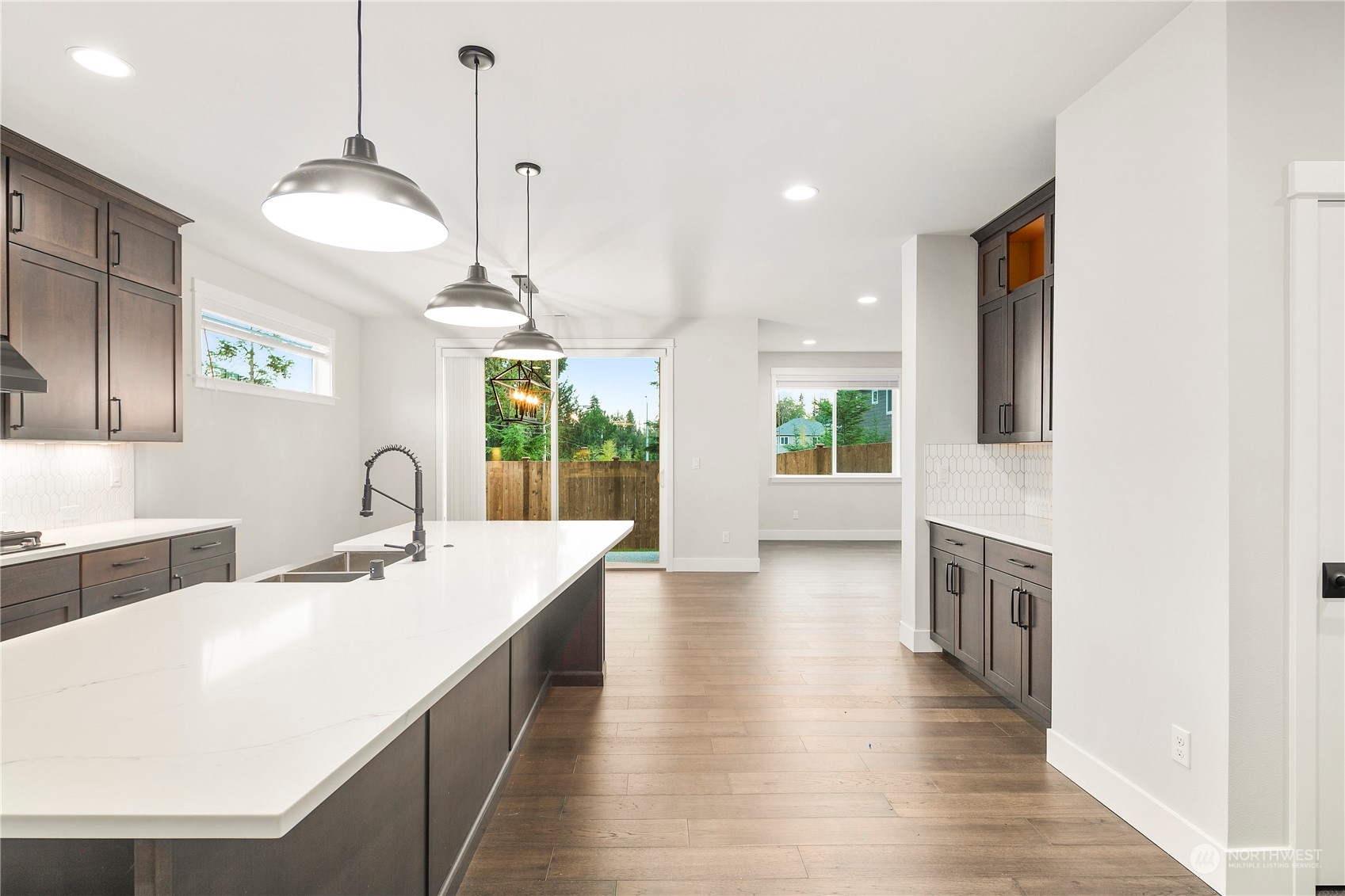1302 197th Place Southeast Bothell, WA 98012 - Photo 6 of 35 a kitchen with stainless steel appliances a sink stove and wooden floor