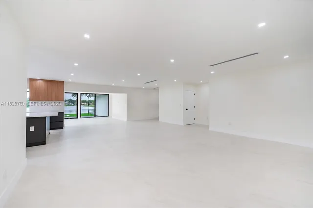 a view of an empty room with a fireplace