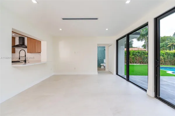 a view of an empty room and window