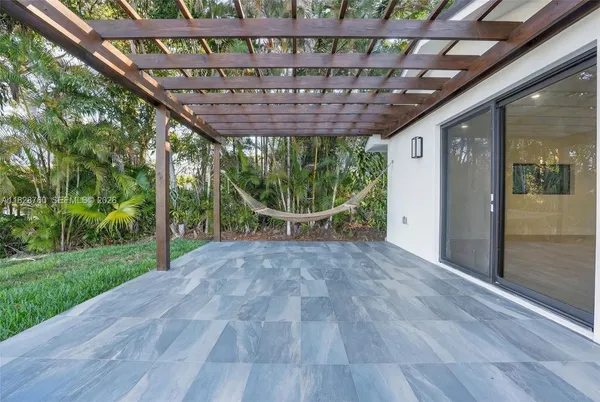 a view of a room with wooden floor and roof