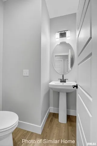 a living room with stainless steel appliances kitchen island granite countertop a couch and a view of living room