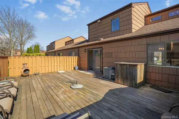 a front view of a house with a wooden fence