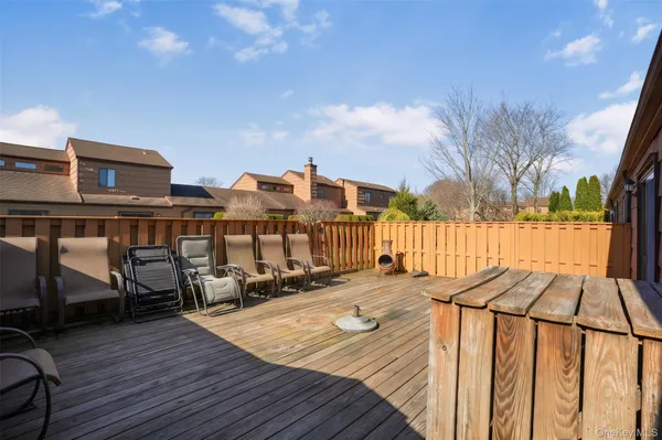 a view of a house with wooden deck