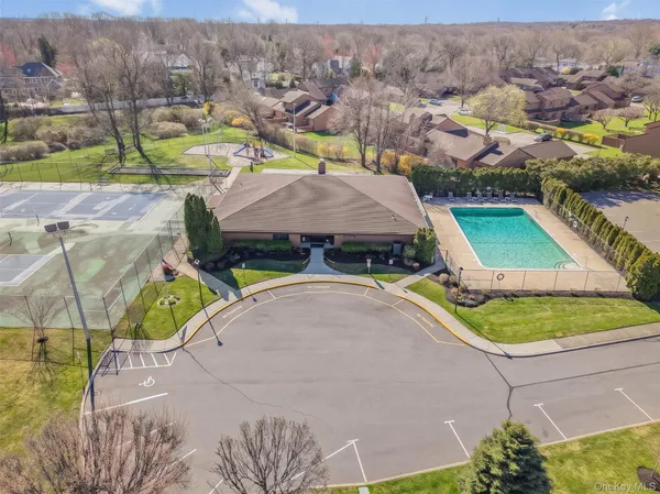 an aerial view of a house with a swimming pool