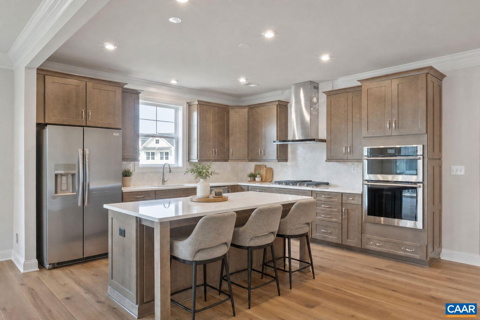 62 C Springdale Road Waynesboro, VA 22980 - Photo 3 of 13 a kitchen with stainless steel appliances granite countertop a refrigerator a sink dishwasher a stove and white countertops with wooden floor